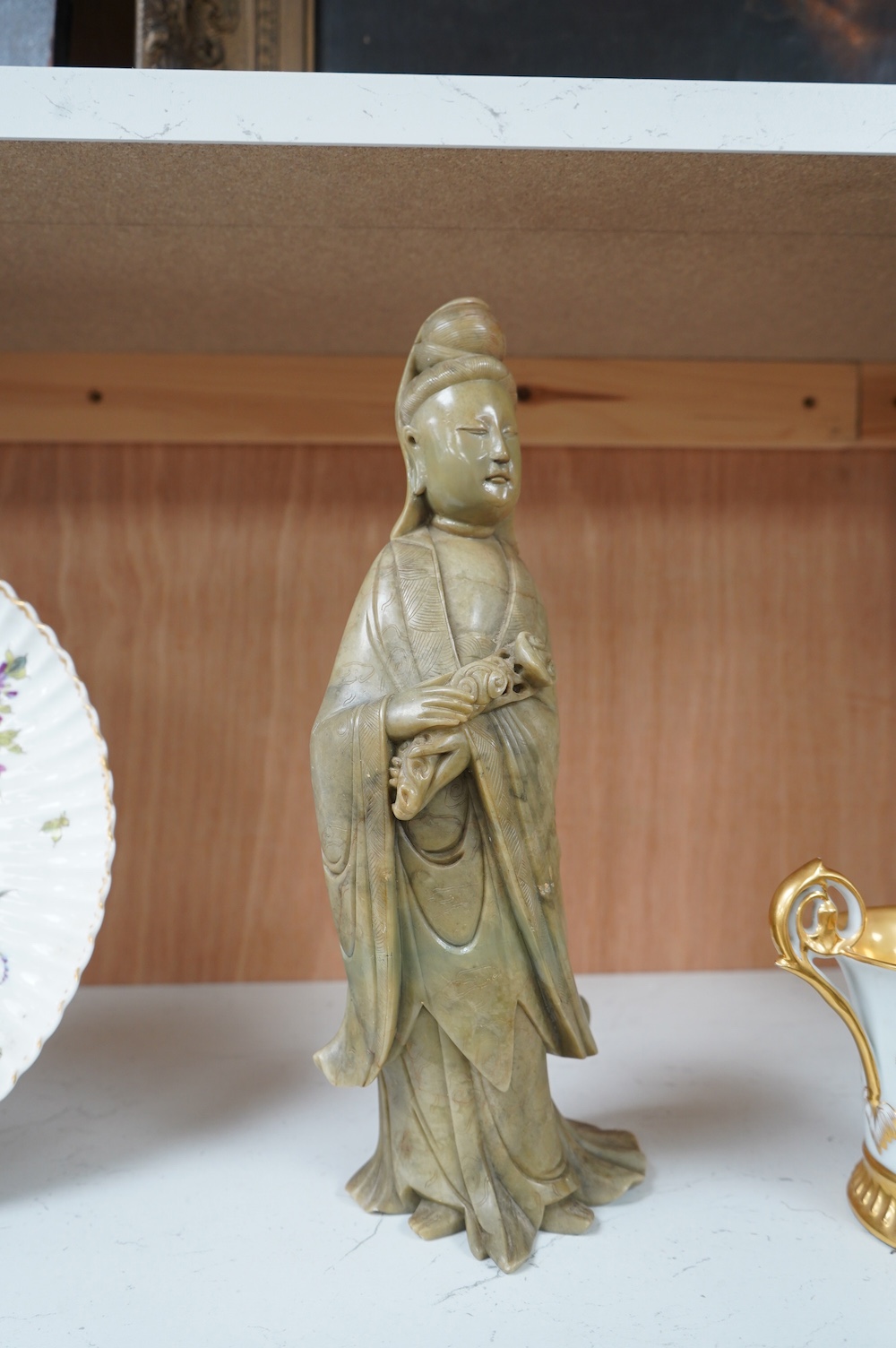 A Chinese soapstone figure of guanyin, 31cm high. Condition - good